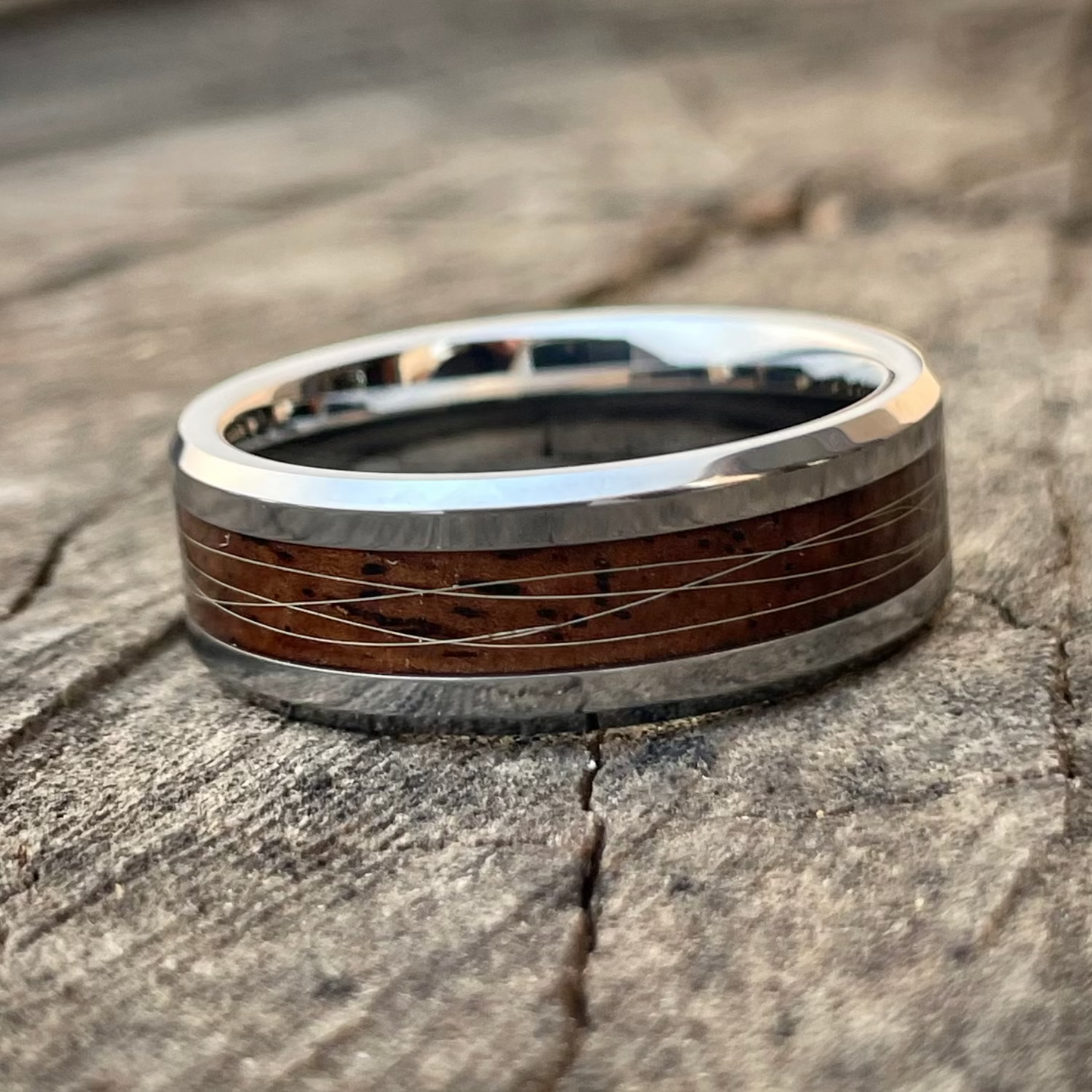 polished Leadwood and lions mane tungsten ring with natural grain pattern